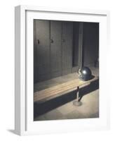 Football Helmet on Bench in Locker Room-null-Framed Photographic Print