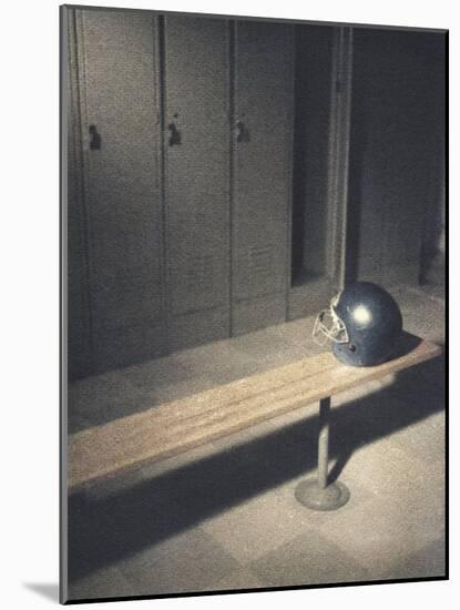 Football Helmet on Bench in Locker Room-null-Mounted Photographic Print