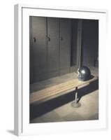 Football Helmet on Bench in Locker Room-null-Framed Photographic Print