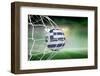 Football in Greece Colours at Back of Net against Football Pitch under Green Sky and Spotlights-Wavebreak Media Ltd-Framed Photographic Print