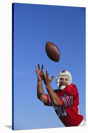 Football Player Catching a Football-DLILLC-Stretched Canvas