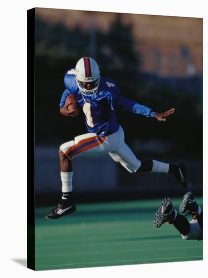 Football Player in Action-null-Stretched Canvas