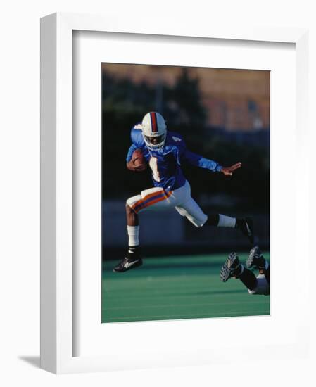 Football Player in Action-null-Framed Photographic Print