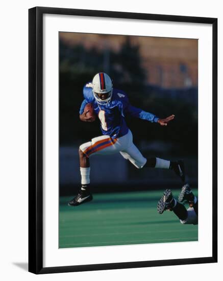 Football Player in Action-null-Framed Photographic Print