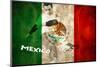 Football Player in Green Kicking against Mexico Flag in Grunge Effect-Wavebreak Media Ltd-Mounted Photographic Print