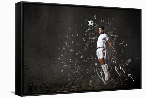 Football Player in Jump Striking Ball with Sketches at Backdrop-Sergey Nivens-Framed Stretched Canvas