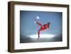 Football Player in Red Kicking against Large Football Stadium with Spotlights under Grey Sky-Wavebreak Media Ltd-Framed Photographic Print