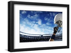 Football Player Raises His Helmet before an Important Game-yobro-Framed Photographic Print