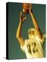 Football Player Reaching Up To Catch a Ball-null-Stretched Canvas