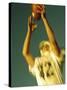 Football Player Reaching Up To Catch a Ball-null-Stretched Canvas