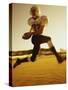 Football Player Running with The Ball-null-Stretched Canvas