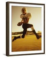 Football Player Running with The Ball-null-Framed Premium Photographic Print