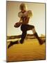 Football Player Running with The Ball-null-Mounted Photographic Print