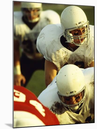 Football Players Playing in a Field-null-Mounted Photographic Print