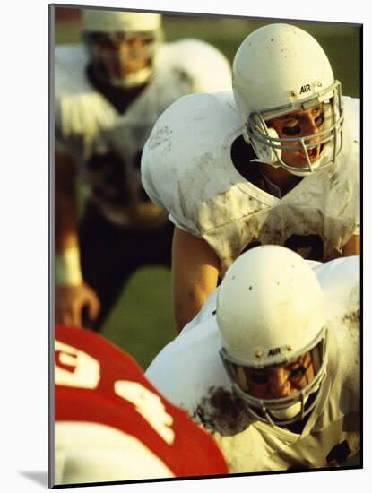 Football Players Playing in a Field-null-Mounted Photographic Print