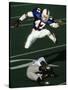 Football Running Back Flys over the Defense-null-Stretched Canvas