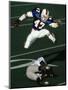 Football Running Back Flys over the Defense-null-Mounted Photographic Print