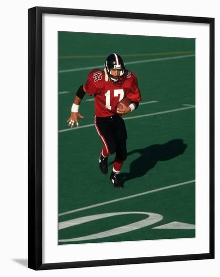 Football Running Back in Action-null-Framed Photographic Print