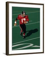 Football Running Back in Action-null-Framed Photographic Print