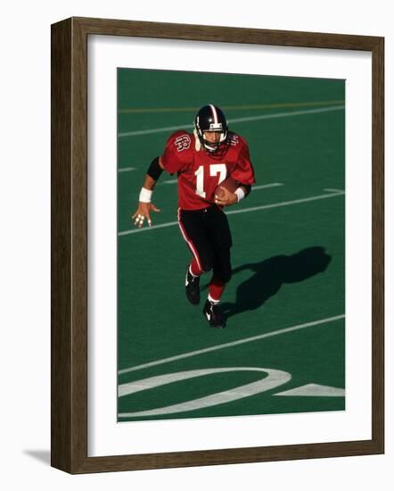 Football Running Back in Action-null-Framed Photographic Print