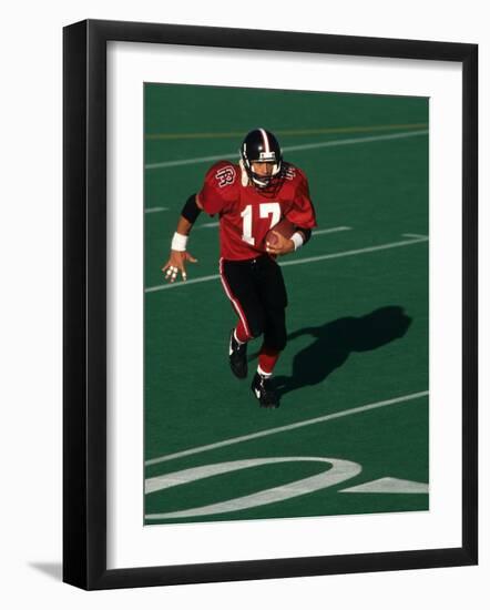 Football Running Back in Action-null-Framed Photographic Print