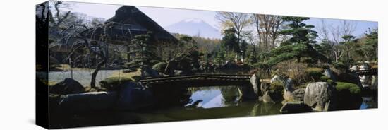 Footbridge in a Garden, Japanese Garden, Oshino, Japan-null-Stretched Canvas
