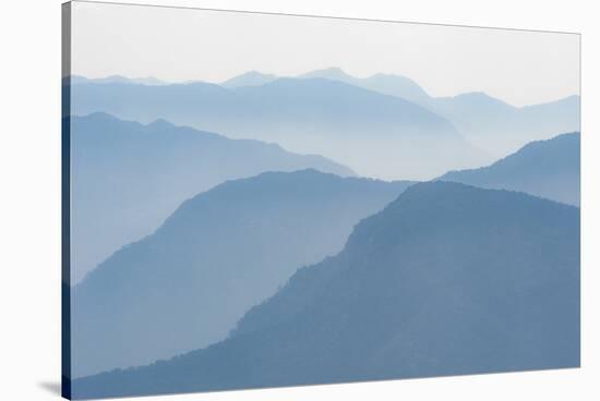 Foothills of the Himalayas in East Bhutan Take on an Ethereal Appearance in Early Morning Mist-Alex Treadway-Stretched Canvas