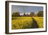 Footpath in rapeseed field to village of Peasemore and St. Barnabas church, Peasemore-Stuart Black-Framed Photographic Print