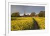 Footpath in rapeseed field to village of Peasemore and St. Barnabas church, Peasemore-Stuart Black-Framed Photographic Print