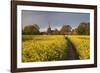 Footpath in rapeseed field to village of Peasemore and St. Barnabas church, Peasemore-Stuart Black-Framed Photographic Print