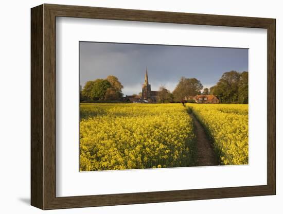 Footpath in rapeseed field to village of Peasemore and St. Barnabas church, Peasemore-Stuart Black-Framed Photographic Print