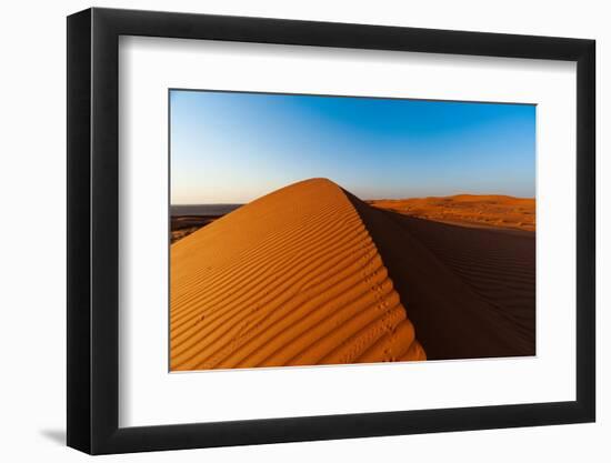 Footprints along the ridge of a sand dune at sunset. Wahiba Sands, Arabian Peninsula, Oman.-Sergio Pitamitz-Framed Photographic Print