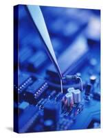 Forceps Holding a Resistor Over a Circuit Board-Chris Knapton-Stretched Canvas