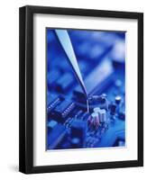 Forceps Holding a Resistor Over a Circuit Board-Chris Knapton-Framed Premium Photographic Print