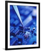 Forceps Holding a Resistor Over a Circuit Board-Chris Knapton-Framed Premium Photographic Print