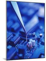 Forceps Holding a Resistor Over a Circuit Board-Chris Knapton-Mounted Photographic Print