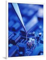 Forceps Holding a Resistor Over a Circuit Board-Chris Knapton-Framed Photographic Print