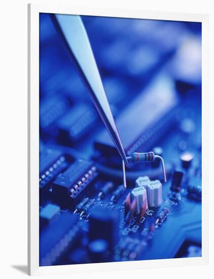 Forceps Holding a Resistor Over a Circuit Board-Chris Knapton-Framed Photographic Print