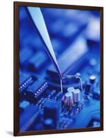 Forceps Holding a Resistor Over a Circuit Board-Chris Knapton-Framed Photographic Print