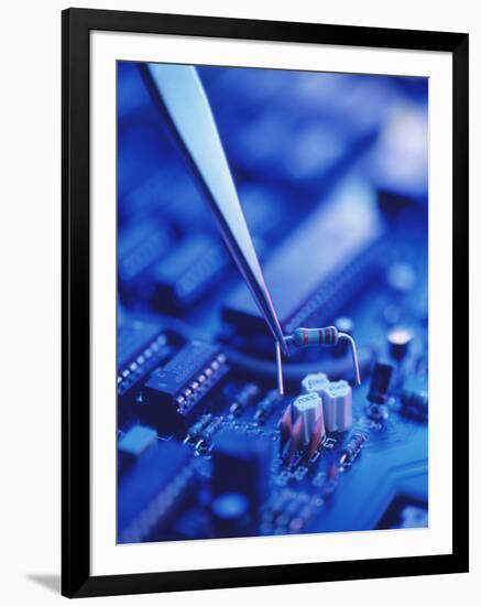 Forceps Holding a Resistor Over a Circuit Board-Chris Knapton-Framed Photographic Print