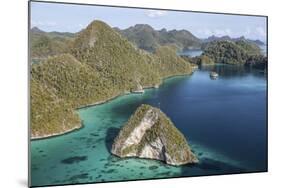 Forest-Covered Limestone Islands Surround a Lagoon in Raja Ampat-Stocktrek Images-Mounted Photographic Print