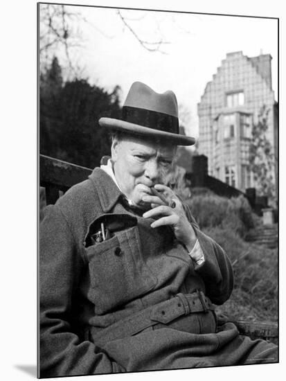Former Pm Winston Churchill Resting on Bench, Puffing on Cigar, Outside Country Estate Chartwell-Hans Wild-Mounted Premium Photographic Print
