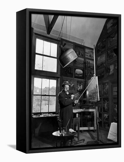 Former PM Winston Churchill Smoking a Cigar in His Studio Dressed in His Blue RAF Siren Jump Suit-Hans Wild-Framed Stretched Canvas