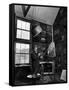 Former PM Winston Churchill Smoking a Cigar in His Studio Dressed in His Blue RAF Siren Jump Suit-Hans Wild-Framed Stretched Canvas