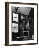 Former PM Winston Churchill Smoking a Cigar in His Studio Dressed in His Blue RAF Siren Jump Suit-Hans Wild-Framed Premium Photographic Print