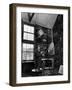 Former PM Winston Churchill Smoking a Cigar in His Studio Dressed in His Blue RAF Siren Jump Suit-Hans Wild-Framed Photographic Print