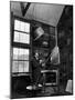 Former PM Winston Churchill Smoking a Cigar in His Studio Dressed in His Blue RAF Siren Jump Suit-Hans Wild-Mounted Photographic Print