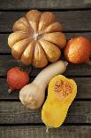 Pumpkin, Butternut- and Hokkaido Squashes on Wooden Background-Fotos mit Geschmack-Photographic Print