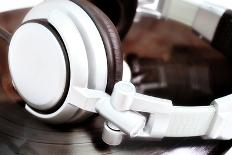 Dj Headphones Lying over Old Vinyl-fotosutra.com-Photographic Print