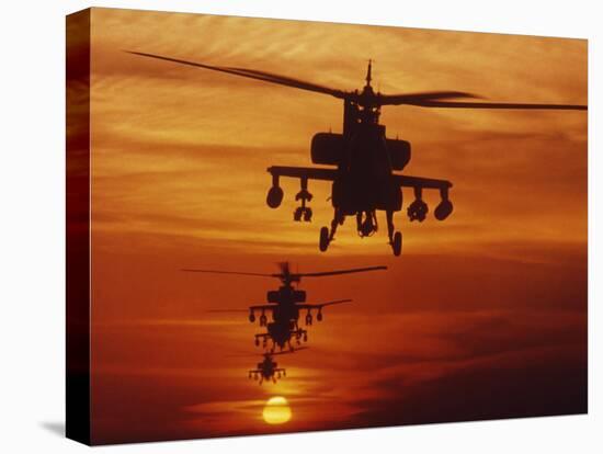 Four AH-64 Apache Anti-armor Helicopters Fly in Formation at Dusk-Stocktrek Images-Stretched Canvas